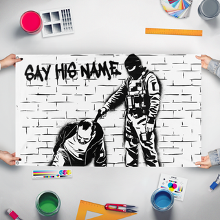 A mockup of the custom flag 'Alex Pretti Say His Name flag' held up on a table during print checking