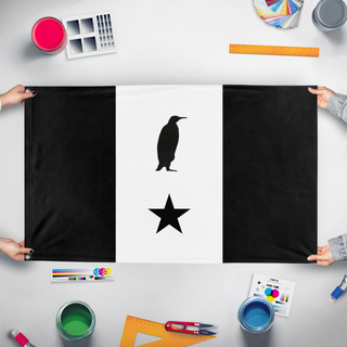 A mockup of the custom flag 'Penguinian Flag' held up on a table during print checking