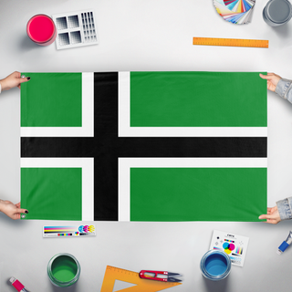 A mockup of the custom flag 'Vinland flag' held up on a table during print checking