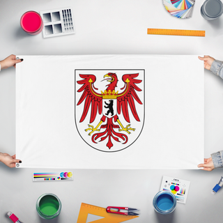 A mockup of the custom flag 'Brandenburg  flag' held up on a table during print checking