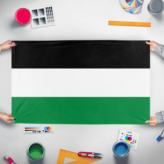 A mockup of the custom flag 'Pan-Arab Tricolor flag' held up on a table during print checking