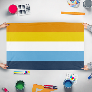 A mockup of the custom flag 'Sunset Flag' held up on a table during print checking
