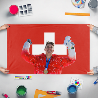 A mockup of the custom flag 'F. Von Allmen flag' held up on a table during print checking