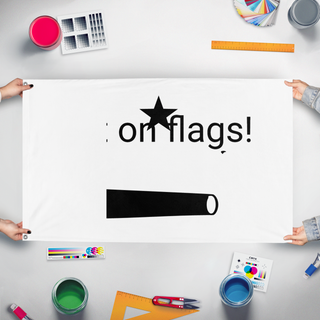 A mockup of the custom flag 'T flag' held up on a table during print checking