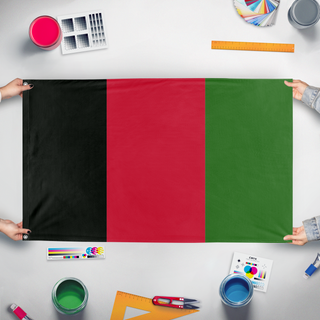 A mockup of the custom flag 'Afgnistan  flag' held up on a table during print checking