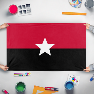 A mockup of the custom flag 'Angora  flag' held up on a table during print checking