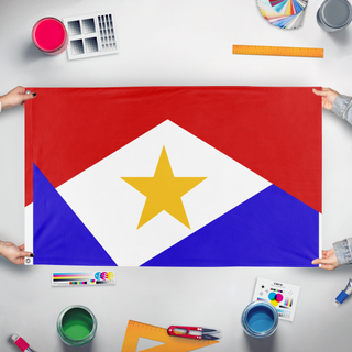 A mockup of the custom flag 'Saba flag' held up on a table during print checking