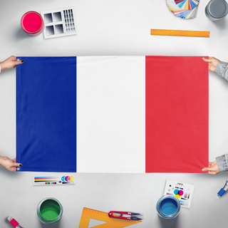 A mockup of the custom flag 'St Peter and miquon flag' held up on a table during print checking