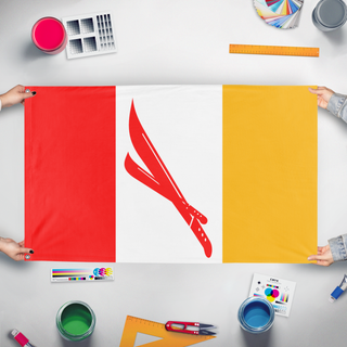 A mockup of the custom flag 'Nuneut flag' held up on a table during print checking