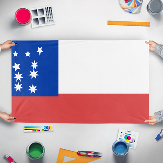 A mockup of the custom flag 'Amazons flag' held up on a table during print checking