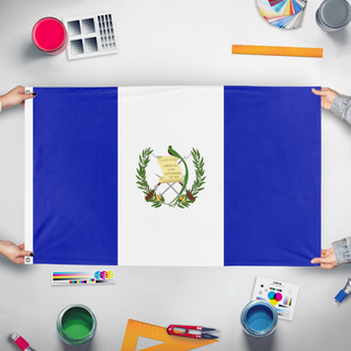 A mockup of the custom flag 'Guatemala  flag' held up on a table during print checking