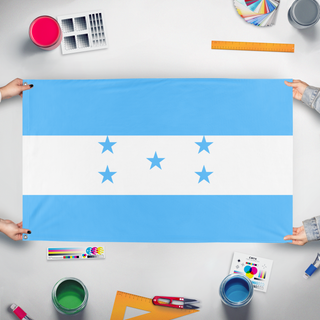 A mockup of the custom flag 'Houndas  flag' held up on a table during print checking