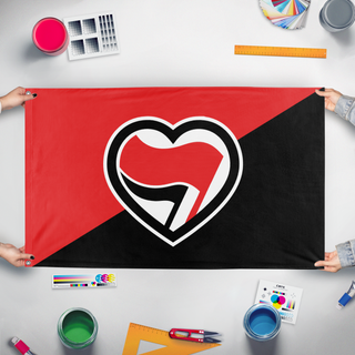 A mockup of the custom flag 'Antifa Love Flag' held up on a table during print checking