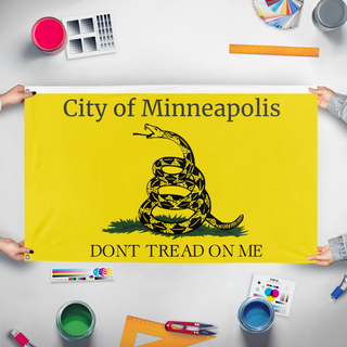 A mockup of the custom flag 'T flag' held up on a table during print checking