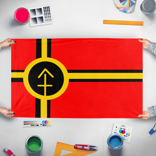 A mockup of the custom flag 'ENAE Flag' held up on a table during print checking