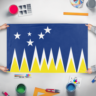A mockup of the custom flag 'Magalines flag' held up on a table during print checking