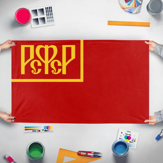 A mockup of the custom flag 'Flag of the Russian Soviet Federative Republic' held up on a table during print checking