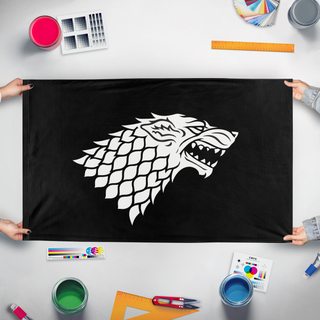 A mockup of the custom flag 'House Stark flag' held up on a table during print checking