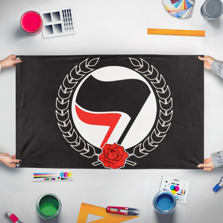 A mockup of the custom flag 'antifa flag' held up on a table during print checking