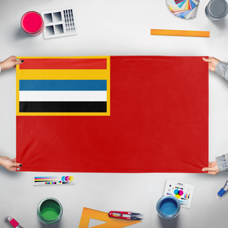 A mockup of the custom flag 'prc flag' held up on a table during print checking