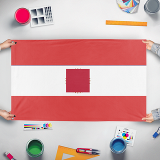 A mockup of the custom flag 'test2 flag' held up on a table during print checking