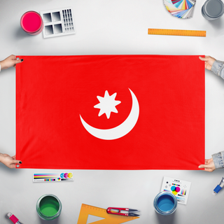 A mockup of the custom flag 'yettishar flag' held up on a table during print checking