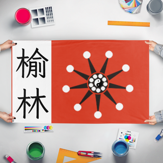 A mockup of the custom flag 'warlord flag' held up on a table during print checking