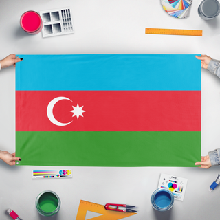 A mockup of the custom flag 'test 1 flag' held up on a table during print checking