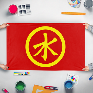 A mockup of the custom flag 'national liberation movement' held up on a table during print checking