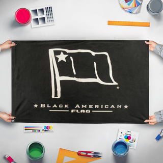 A mockup of the custom flag 'Bflag' held up on a table during print checking