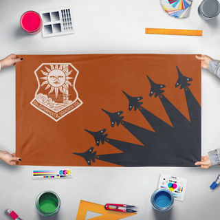 A mockup of the custom flag 'Ace Combat Sol Squadron flag' held up on a table during print checking