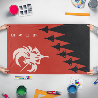 A mockup of the custom flag 'Ace Combat SACS squadron flag' held up on a table during print checking