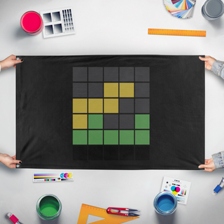 A mockup of the custom flag 'Irdm wordle flag' held up on a table during print checking