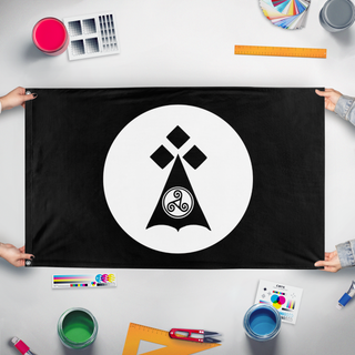 A mockup of the custom flag 'brittany  flag' held up on a table during print checking