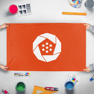 A mockup of the custom flag 'Federal republic of Erusea flag' held up on a table during print checking