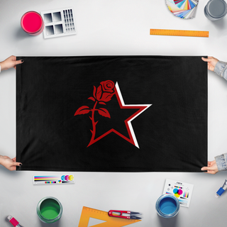 A mockup of the custom flag 'ngnm flag' held up on a table during print checking
