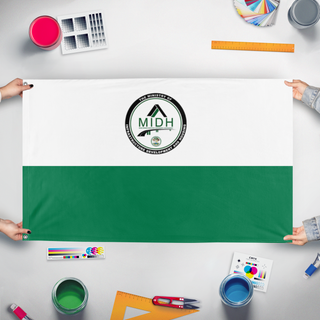 A mockup of the custom flag 'Ministry of Infrastructure Development and Housing  flag' held up on a table during print checking