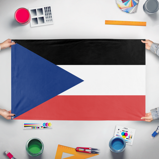 A mockup of the custom flag 'columia flag' held up on a table during print checking