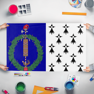 A mockup of the custom flag 'brittany flag' held up on a table during print checking