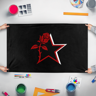 A mockup of the custom flag 'ngnm flag' held up on a table during print checking