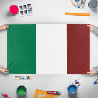 A mockup of the custom flag 'Italy flag' held up on a table during print checking