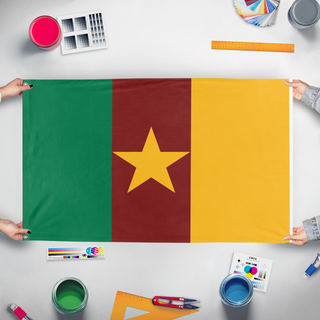 A mockup of the custom flag 'Cameron  flag' held up on a table during print checking