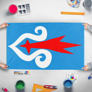 A mockup of the custom flag 'ainu flag' held up on a table during print checking