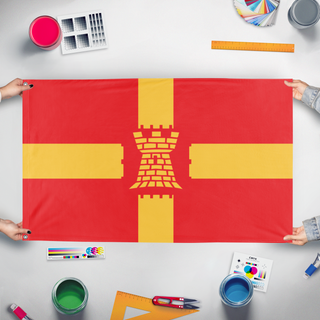 A mockup of the custom flag 'Greater Manchester Redesign flag' held up on a table during print checking