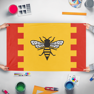 A mockup of the custom flag 'City of Manchester flag' held up on a table during print checking