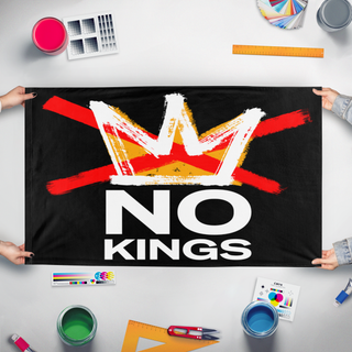A mockup of the custom flag 'NO KINGS flag' held up on a table during print checking