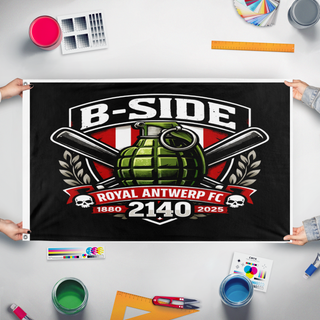 A mockup of the custom flag 'b side flag' held up on a table during print checking