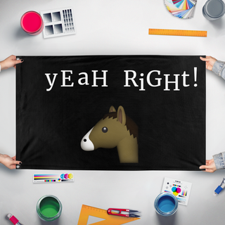 A mockup of the custom flag 'YEAH RIGHT flag' held up on a table during print checking