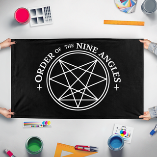 A mockup of the custom flag 'O9A flag' held up on a table during print checking