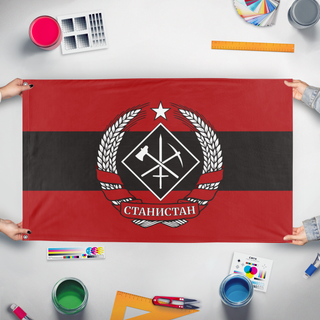 A mockup of the custom flag 'Stanistan Revolutionary flag' held up on a table during print checking